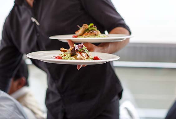 waiter carrying two plates