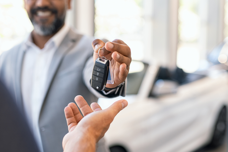 car dealer handing over the keys