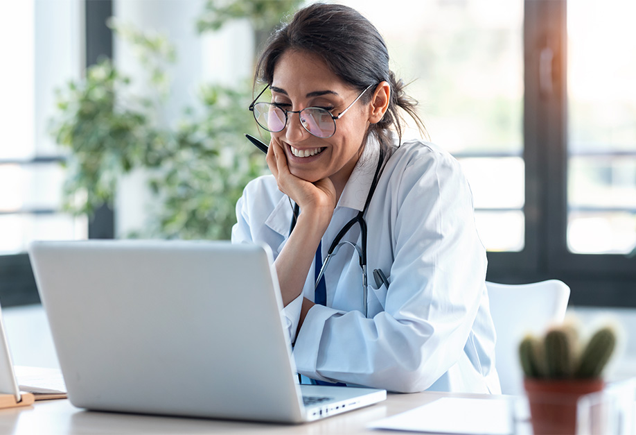 doctor looking at a computer