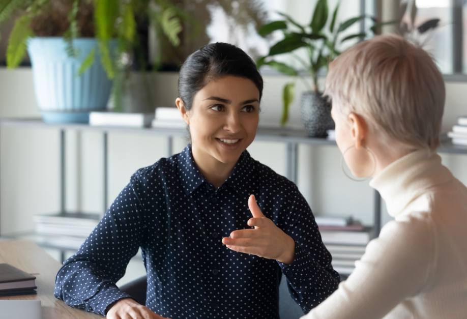 Woman talking to her colleague